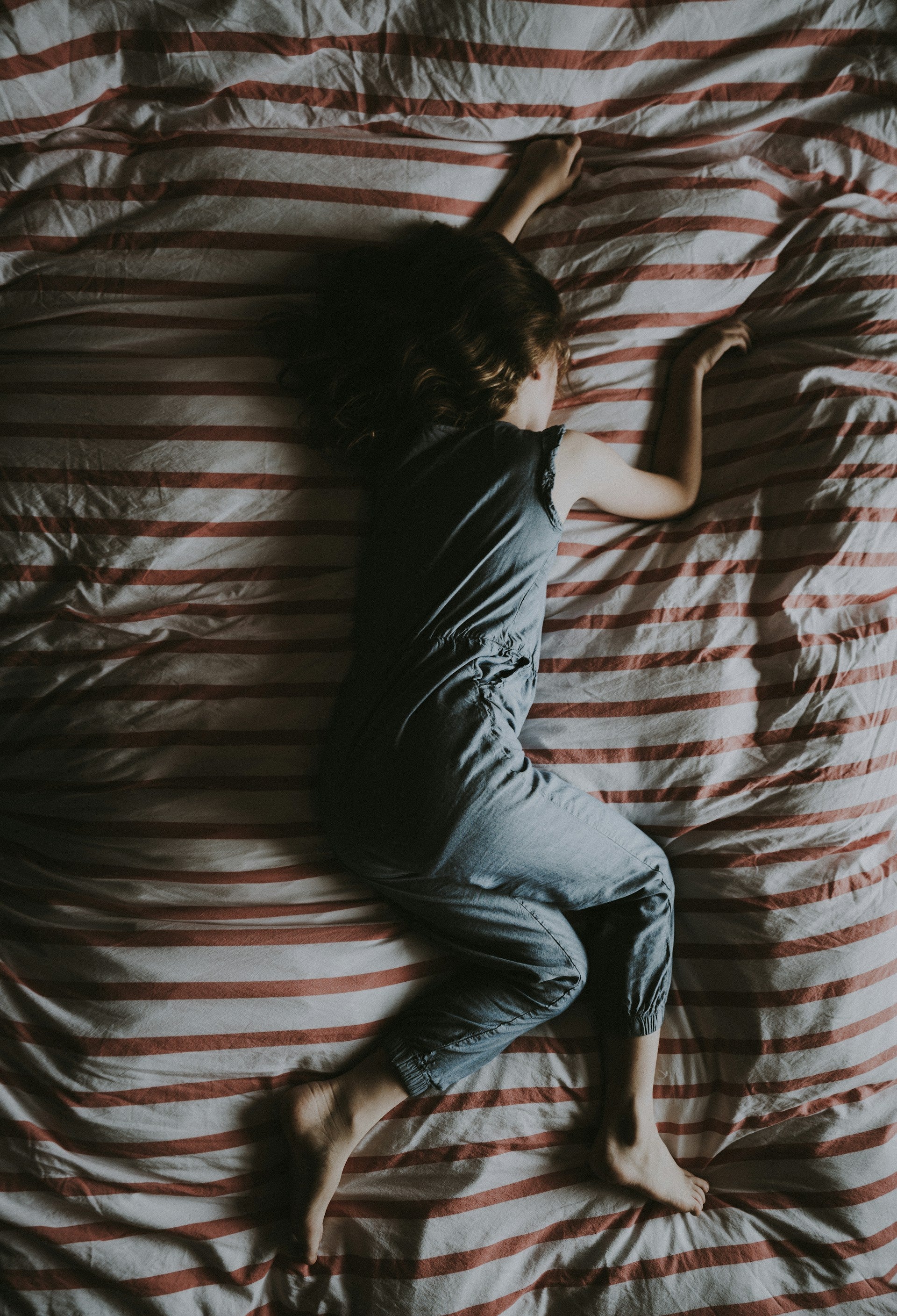 girl-sleeping-on-bed