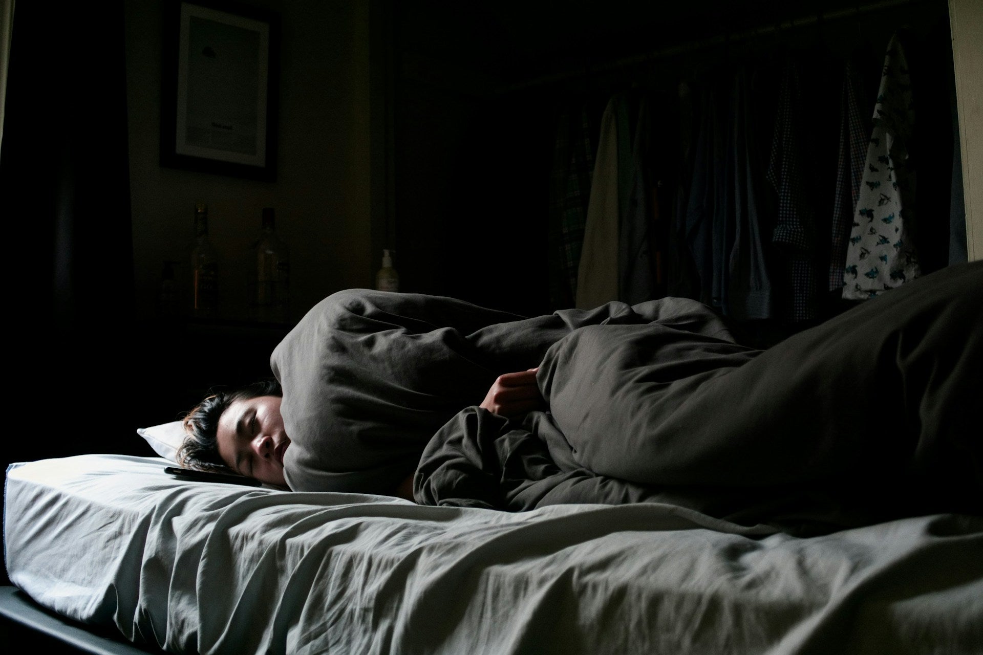 girl-sleeping-wrapped-up-in-sheets